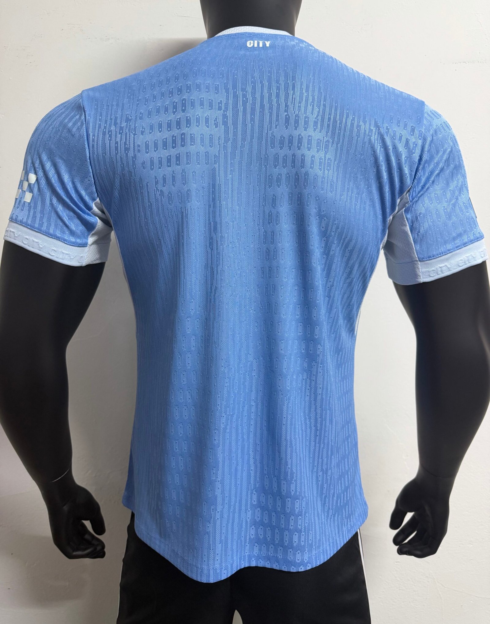 Alternative view of Player 26-27 Manchester City home with Premier League plush badge